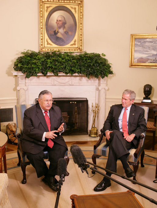 President George W. Bush listens as President Jalal Talabani of Iraq addresses members of the media in the Oval Office Thursday, May 31, 2007. White House photo by Eric Draper