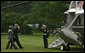 President George W. Bush salutes as he and Mrs. Laura Bush board Marine One Monday, June 4, 2007, on the South Lawn. The President and Mrs. Bush are traveling to Europe this week. They will visit the Czech Republic, Poland, Italy, the Vatican, Albania, Bulgaria and attend the G8 Summit in Germany. White House photo by Joyce N. Boghosian