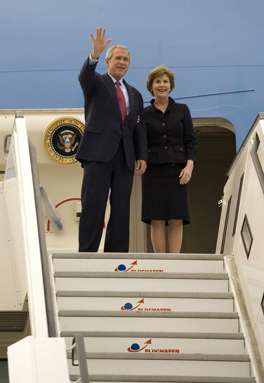 President George W. Bush and Mrs. Laura Bush wave as they arrive Tuesday, June 6, 2007, in Rostock, Germany. The couple will spend the next two days in nearby Heiligendamm, site of this year's G8 Summit. White House photo by Eric Draper