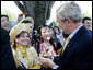 President George W. Bush signs autographs following his speech Tuesday, June 12, 2007, at the dedication ceremony for the Victims of Communism Memorial in Washington, D.C. White House photo by Joyce N. Boghosian