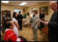 Mrs. Laura Bush speaks with Naw K'nyaw Paw at a meeting with members of the Burma Ethnic Nationalities Council delegation Tuesday, June 12, 2007 at the White House, to discuss the current conditions in Burma. While in Washington D.C., the delegation also met with officials at the U.S. Department of State and members of Congress. Congressman Joseph R. Pitts, right, encouraged the ethnic leaders of Burma to come to Washington to testify to the plight of the peoples of Burma. White House photo by Shealah Craighead