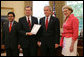 President George W. Bush receives the Report to the President on Issues Raised by the Virginia Tech Tragedy in the Oval Office Wednesday, June 13, 2007, presented to President Bush by Attorney General Alberto Gonzales; U.S. Secretary of Health and Human Services Michael O. Leavitt and U.S. Secretary of Education Margaret Spellings. The report was compiled by the departments of Justice, Health and Human Services and Education in response to the tragic shooting rampage at Virginia Tech April 16, 2007 in Blacksburg, Va.  White House photo by Eric Draper