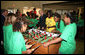 President George W. Bush joins a heated game of foosball Friday, June 15, 2007, during his visit to the Boys and Girls Club of South Central Kansas - 21st Street Club in Wichita. White House photo by Eric Draper