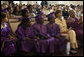 Mrs. Laura Bush sits with sixth-grade of the Elsie Whitlow Stokes Community Freedom Public Charter School graduates during ceremony marking their accomplishment Friday, June 15, 2007, at All Souls Unitarian Church in Washington, D.C. "Keep caring for the community," said Mrs. Bush in her commencement address. "Be good stewards of our environment, as you were when you helped clean up the Potomac River at Hard Bargain Farm." White House photo by Shealah Craighead