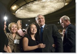 President George W. Bush greets audience members after addressing the National Hispanic Prayer Breakfast Friday, June 15, 2007, in Washington, D.C. “Our nation is more hopeful because of the Hispanic Americans who serve in the armies of compassion, who are surrounding neighbors in need who hurt with love; people who are helping to change America one heart and one soul and one conscience at a time,” said the President in his remarks. White House photo by Joyce N. Boghosian