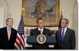 President George W. Bush and outgoing director of the Office of Management and Budget Rob Portman, left, listen as former Iowa Rep. Jim Nussle addresses the media Tuesday, June 19, 2007 in the Roosevelt Room of the White House, thanking President Bush for nominating him to be the next director of the OMB.  White House photo by Chris Greenberg