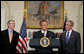 President George W. Bush and outgoing director of the Office of Management and Budget Rob Portman, left, listen as former Iowa Rep. Jim Nussle addresses the media Tuesday, June 19, 2007 in the Roosevelt Room of the White House, thanking President Bush for nominating him to be the next director of the OMB. White House photo by Chris Greenberg