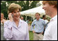 Mrs. Laura Bush surprises a caller on guest’s cell phone Tuesday evening, June 19, 2007, at the annual White House Congressional Picnic on the South Lawn. White House photo by Shealah Craighead