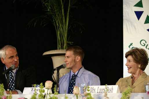 Mrs. Laura Bush listens to Paul Alt, left, a Team Focus mentor to Tony Javens, center, during a visit Thursday, June 21, 2007, to Team Focus’s National Leadership Camp, in Mobile, Ala. White House photo by Shealah Craighead