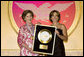 Dorothy Hamill, 1976 US Gold Medal Olympic Champion, presents Mrs.Laura Bush the Academy of Achievement Golden Plate Award Friday, June 22, 2007, during a ceremony in Washington, D.C. Mrs. Bush was presented the award for her achievements in Public Service, Friday, June 22, 2007. President George H.W. Bush received the Golden Plate Award in 1995. White House photo by Shealah Craighead