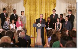 President George W. Bush congratulates the 2007 Presidential Scholars Monday, June 25, 2007 in the East Room of the White House, and highlights the need to reauthorize the No Child Left Behind Act this year. White House photo by Joyce N. Boghosian