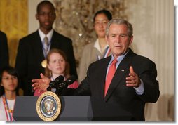 President George W. Bush gestures as he congratulates the 2007 Presidential Scholars Monday, June 25, 2007 in the East Room of the White House, and highlights the need to reauthorize the No Child Left Behind Act this year. White House photo by Joyce N. Boghosian