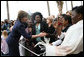 Mrs. Laura Bush greets U.S. Embassy employees and staff Wednesday, June 27, 2007, during her visit to Maputo, Mozambique. White House photo by Shealah Craighead