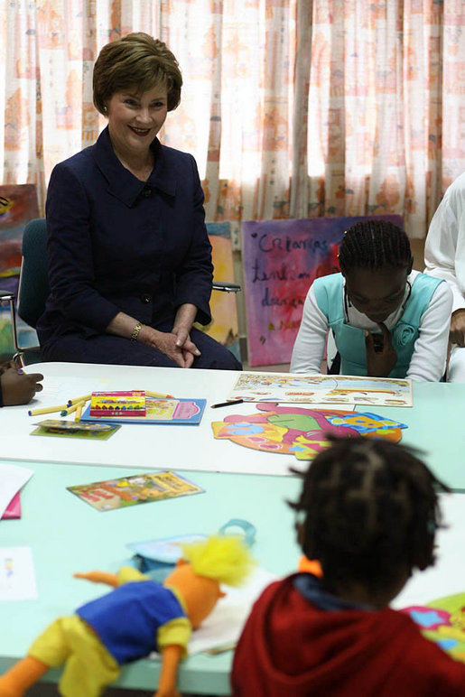 Mrs. Laura Bush visits with young patients at Maputo Central Pediatric Day Hospital Wednesday, June 27, 2007, in Maputo, Mozambique. Said Mrs. Bush, "It is terrific to be here at the Pediatric Day Hospital; I was thrilled the beautiful artwork that the children created to express their ideas and feelings, and I enjoyed meeting the mothers of those children in the Positive Tea support group. The Positive Tea support group is a great opportunity for mothers to come together to discuss their concerns and questions." White House photo by Shealah Craighead