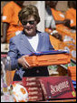 Mrs. Laura Bush assembles a home care kit at the Mututa Memorial Center Thursday, June 28, 2007, in Lusaka, Zambia. The center provides many humanitarian services including home-based care for people living with HIV/AIDS, care for orphans and promotes abstinence and faith for youth. It serves more than 150 individuals with a core of 36 trained caregivers. White House photo by Shealah Craighead