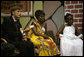 U.S. Global AIDS Coordinator Ambassador Mark Dybul holds up a SMART card during a roundtable discussion with Mrs. Laura Bush, Mrs. Maureen Mwanawasa, doctors, patients and officials about HIV/AIDS at Chreso Ministries, which provides counseling, testing and support for people living with HIV/AIDS, Thursday, June 28, 2007, in Lusaka, Zambia. The card contains the medical history of its holder and facilitates accurate and efficient health care for patients. White House photo by Shealah Craighead