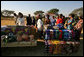 At the Flame Community Center in Lusaka, Zambia, Mrs. Laura Bush, Ms. Jenna Bush and Zambian First Lady Mrs. Maureen Manawasa visit a marketplace demonstrating small enterprises begun with the help of WORTH, a program that trains women in literacy, group savings, peer lending and small business development. White House photo by Shealah Craighead