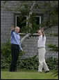 President George W. Bush and Russia's President Vladimir Putin wave as they leave a press availability Monday, July 2, 2007, at Walker's Point in Kennebunkport, Me. White House photo by Joyce N. Boghosian