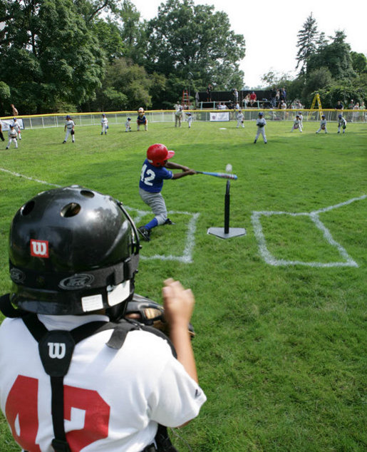 The game is on between the Inner City Little League of Brooklyn, N.Y. and the Wrigley Little League Dodgers of Los Angeles, all wearing the number 42 in honor of Hall of Fame player Jackie Robinson, at the White House Tee Ball Game on the South Lawn of the White House Sunday, July 15, 2007. Brooklyn and Los Angeles represent the two home cities of Robinson's team. More about Tee Ball on the South Lawn. White House photo by Chris Greenberg