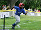 A player from the Inner City Little League of Brooklyn, N.Y. runs for first base after his hit against the Wrigley Little League Dodgers of Los Angeles Sunday, July 15, 2007 at the White House Tee Ball Game, in honor of legendary baseball player Jackie Robinson. More about Tee Ball on the South Lawn. White House photo by Chris Greenberg