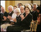 Mrs. Laura Bush, seated next to design award recipient Robert Venturi, applauds the winners of the 2007 Cooper-Hewitt National Design Awards Wednesday, July 18, 2007, in the East Room of the White House. White House photo by Shealah Craighead