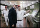 President George W. Bush is shown a section of the bun production line by an employee Thursday, July 19, 2007, at the Nashville Bun Company in Nashville, Tenn. White House photo by Chris Greenberg