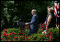 Standing with veterans and military family members, President George W. Bush delivers remarks on the Global War on Terror Friday, July 20, 2007, in the Rose Garden. "When Congress returns after Labor Day, there will be less than one month before the fiscal year ends and current funds for Defense Department operations run out," said the President. "Congress still has an opportunity to do right by our men and women in uniform -- and our national security. So today I call on Congress to take action and get this vital piece of legislation to me to sign -- on budget and on time." White House photo by Joyce N. Boghosian