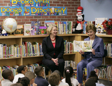  Mrs. Laura Bush, joined by U.S. Secretary of Education Margaret Spellings, reads to children at the Driggs School in Waterbury, Conn., Tuesday, July 24, 2007. Mrs. Bush also announced the 2007 Improving Literacy through School Libraries grants being awarded by the U.S. Department of Education. White House photo by Shealah Craighead