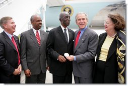 President George W. Bush presents the Congressional Gold Medal to Tuskegee Airman Earl Middleton Tuesday, July 24, 2007, joined by Middleton’s son, Kenny; South Carolina Senator Lindsey Graham, left, and Middleton family friend Joy Barnes, right, at the Charleston AFB in Charleston, S.C. White House photo by Eric Draper