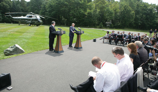 President George W. Bush and British Prime Minister Gordon Brown address the press Monday, July 30, 2007, at Camp David near Thurmont, Md. White House photo by Eric Draper