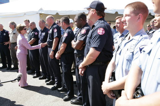 Mrs. Laura Bush greets members of Minnesota Task Force 1-Urban Search and Rescue and other first responders at an Emergency Operation Command Center at the site of the I-35W bridge collapse in Minneapolis, Friday, Aug. 3, 2007. White House photo by Chris Greenberg