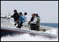 President George W. Bush and President Nicolas Sarkozy of France ride in a boat driven by former President George H. W. Bush during a visit to Walker’s Point Saturday, August 11, 2007, in Kennebunkport, Maine. White House photo by Joyce N. Boghosian