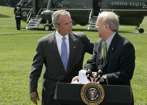 President George W. Bush puts his hand on the shoulder of Karl Rove Monday, August 13, 2007, after the longtime Deputy Chief of Staff and Senior Advisor announced his resignation during a statement on the South Lawn. In thanking Mr. Rove for his service and friendship, the President said, ". I thank my friend. I'll be on the road behind you here in a little bit." White House photo by Joyce N. Boghosian