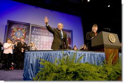 President George W. Bush waves to the crowd as he is introduced by Veterans of Foreign Wars National Commander Gary Kurpius Wednesday, Aug. 22, 2007, to the Veterans of Foreign Wars National Convention in Kansas City, Mo. White House photo by Chris Greenberg