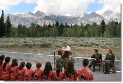 Mrs. Laura Bush speaks to Junior Ranger participants during her visit to Grand Teton National Park Aug. 27, 2007, in Moose, Wyo. "Children here can go back to the prehistoric era at Fossil Butte National Monument, where the remains of fish and insects, snails, turtles, birds, bats and plants are preserved in 50-million-year-old layers of rock," said Mrs. Bush in her address. "Young people can discover the stories of their ancestors, the American pioneers, who migrated west along the Oregon Trail at the Fort Laramie National Area." White House photo by Shealah Craighead