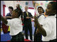 President George W. Bush and Louisiana Governor Kathleen Blanco, left, play musical instruments during a children's program at the Dr. Martin Luther King Jr. Charter School for Science and Technology, Wednesday, Aug. 29, 2007, in New Orleans. White House photo by Chris Greenberg