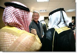 President George W. Bush greets local leaders of Al Anbar Province before their meeting at Al Asad Airbase, Al Anbar Province, Iraq, Monday, September 3, 2007. White House photo by Eric Draper