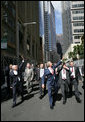 President George W. Bush and Prime Minister John Howard, of Australia, wave to well-wishers Wednesday, Sept. 5, 2007, after leaving the Commonwealth Parliament Offices and walking to the InterContinental Hotel in Sydney. White House photo by Eric Draper