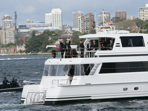 President George W. Bush and Prime Minister John Howard of Australia, wave as they take a tour of Sydney Harbour Wednesday, Sept. 5, 2007. The President is spending the day in meetings with the Prime Minister and will join him later this week at the 2007 APEC summit. White House photo by Chris Greenberg