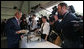 President George W. Bush smiles as he greets a young lady during a luncheon Wednesday, Sept. 5, 2007, on Garden Island in Sydney. White House photo by Chris Greenberg