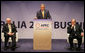 Flanked by Australia's Prime Minister John Howard, left, and Mark Johnson, Chairman of the APEC Business Advisory Council, President George W. Bush delivers remarks Friday, Sept. 7, 2007, to the APEC Business Summit at the Sydney Opera House. President Bush told his audience, "America's commitment to the Asia Pacific region was forged in war and sealed in peace. America is committed to the security of the Asia Pacific region, and that commitment is unshakable." White House photo by Eric Draper