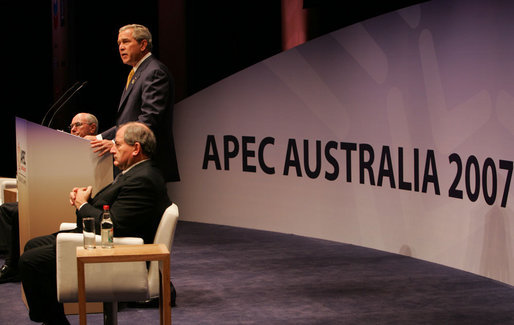 President George W. Bush speaks to the APEC Business Summit Friday, Sept. 7, 2007, at the Sydney Opera House. Joining him on stage are Australia's Prime Minister John Howard, far left, and Mark Johnson, Chairman of the APEC Business Advisory Council. White House photo by Chris Greenberg