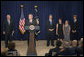 President George W. Bush speaks during the swearing-in ceremony of Jim Nussle as the Director of the Office of Management and Budget in the Dwight D. Eisenhower Executive Office Building Monday, Sept. 10, 2007. Standing with Director Nussle is his wife Karen Nussle, his daughter Sarah and his son Mark. "It's our responsibility to ensure that we run our government wisely and to spend the people's money wisely. Jim Nussle understands that. He also understands that cutting taxes has helped our economy grow," said President Bush. White House photo by Joyce N. Boghosian