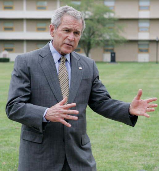 President George W. Bush gestures as he talks with members of the media following his lunch with U.S. Marines during his visit to The Basic School at Quantico Marine Corps Base Friday, Sept.14, 2007 in Quantico, Va. White House photo by Chris Greenberg