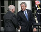 President George W. Bush shakes the hand of Judge Michael Mukasey after announcing his nomination to be U.S. Attorney General Monday, Sept. 17, 2007, in the Rose Garden. White House photo by Eric Draper