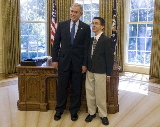 President George W. Bush stands with 14-year-old Evan O'Dorney, the 2007 Scripps Spelling Bee Champion. The Danville, California, home-schooled teenager won the national competition in May by correctly spelling the word "serrefine." He and his parents visited the Oval Office Monday, Sept. 17, 2007. White House photo by Joyce N. Boghosian