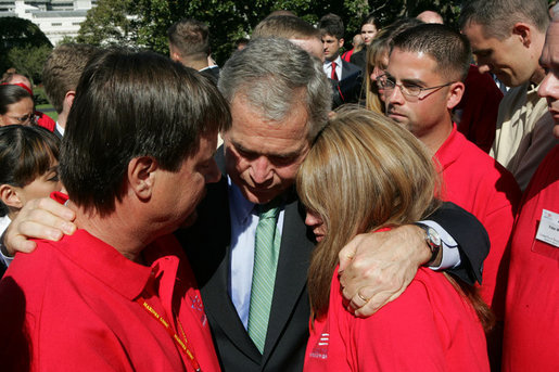 President George W. Bush consoles Ronald Klopf and Lisa West-Klopf, both of Aguanga, Calif., during a gathering of military support organizations Tuesday, Sept. 18, 2007, on the South Lawn. Their son, Lance Cpl. Jeromy West, was killed November of 2006 while serving with the U.S. Marines in Iraq. White House photo by Chris Greenberg