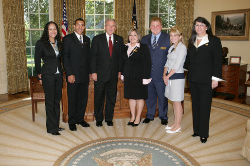 President George W. Bush meets with the 2007 Boys and Girls Clubs of America regional finalists, including Youth of the Year, Wednesday, Sept. 19, 2007 in the Oval Office. From left to right are, Reyneisha Sharp of Alton, Ill., Midwest Region Youth of theYear; Demetrice Tuttle of LaGrange, Ga., the 2007 National Youth of the Year; Brittny Cantero of Wharton, Texas, Southwest Region Youth of the Year; Gino Binkert of Pittsburgh, Pa., Northeast Region Youth of the Year; Sasha Andersen of Bullhead City, Ariz., Pacific Region Youth of the Year; and Roxanne Spillett, president of the Boys and Girls Clubs of America. White House photo by Joyce N. Boghosian