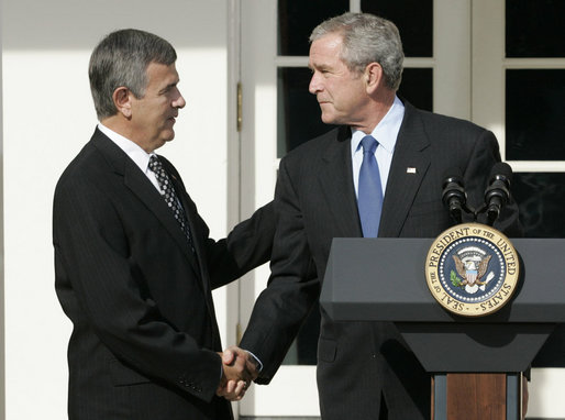 President George W. Bush shakes the hand of Mike Johanns, resigning Secretary of Agriculture, after he announced the secretary's decision to return to his home state of Nebraska during a morning statement in the Rose Garden. White House photo by Joyce N. Boghosian