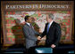 President George W. Bush shakes hands with Tanzania President Jakaya Kikwete during their participation in a Roundtable on Democracy Tuesday, Sept. 25, 2007, at the United Nations in New York. White House photo by Eric Draper